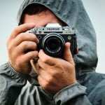 Pascal Basel helping student with camera settings